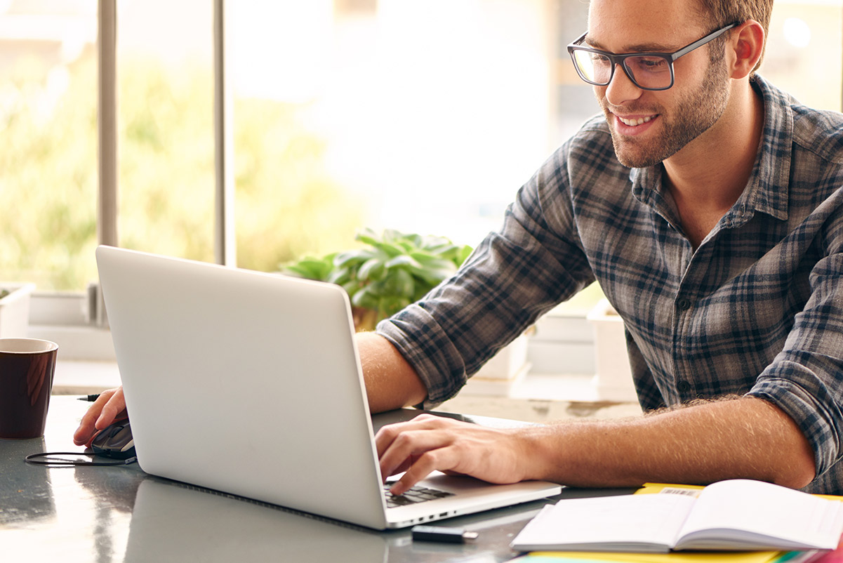 Man taking course on laptop